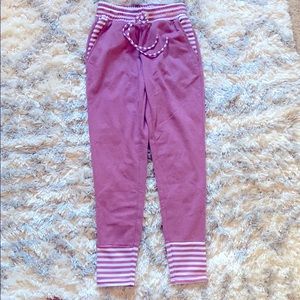 Pink sweatpants with stripes detail